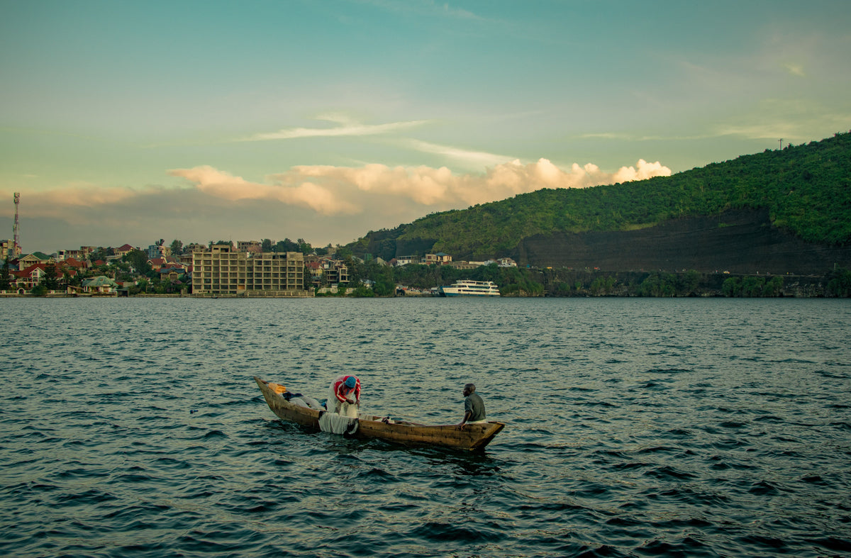 Canoe on a river at dusk, Republic of the Congo