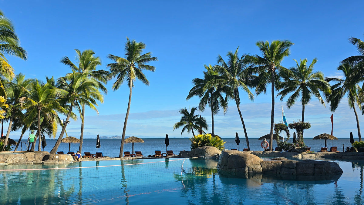 Palm trees by a lagoon pool, Fiji