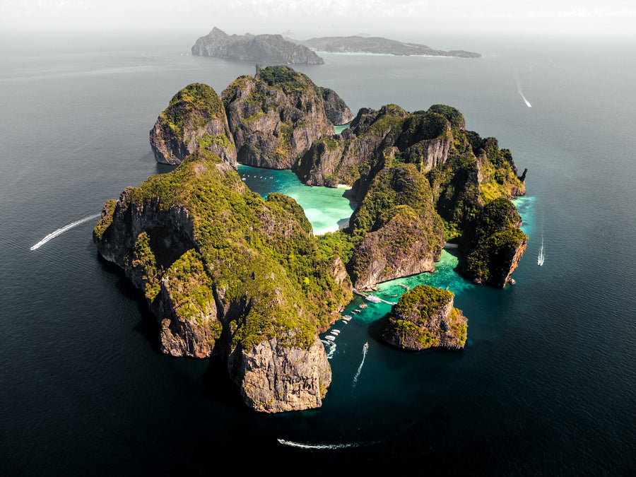 Koh Phi Phi Leh from above, with steep limestone cliffs around turquoise lagoons