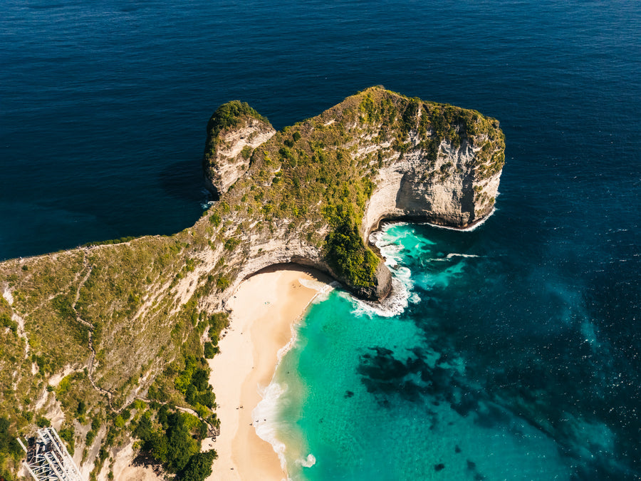 Kelingking Beach below its T-shaped cliff on Nusa Penida