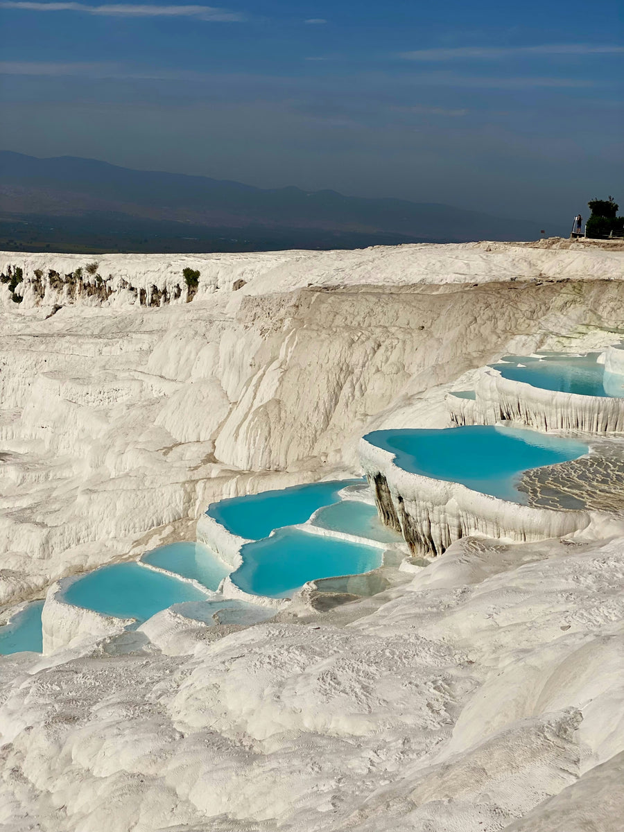 White travertine terraces with turquoise pools at Pamukkale