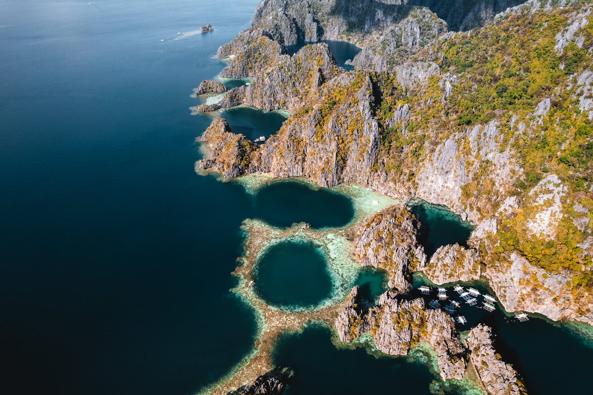 Aerial view of limestone cliffs and lagoons in Coron, Palawan