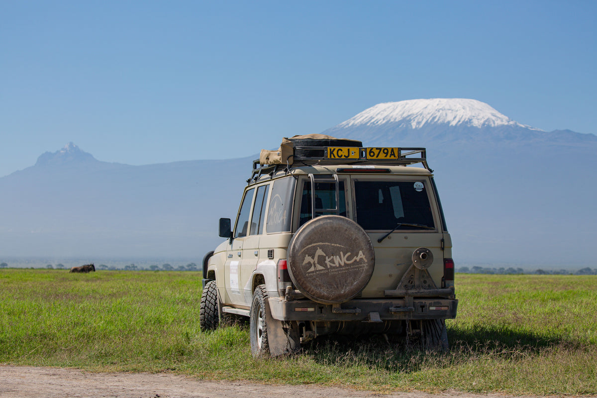 Safari jeep with Kilimanjaro behind, Tanzania