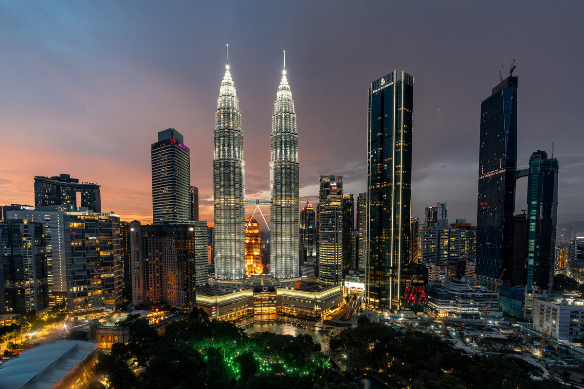 The Petronas Twin Towers and the Kuala Lumpur skyline at dusk