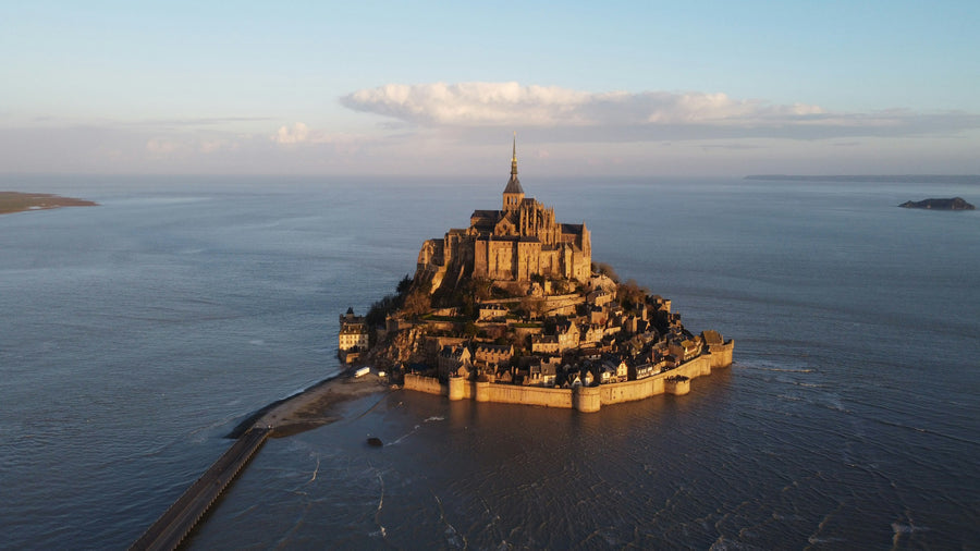 Mont-Saint-Michel abbey on its island at sunset, seen from above
