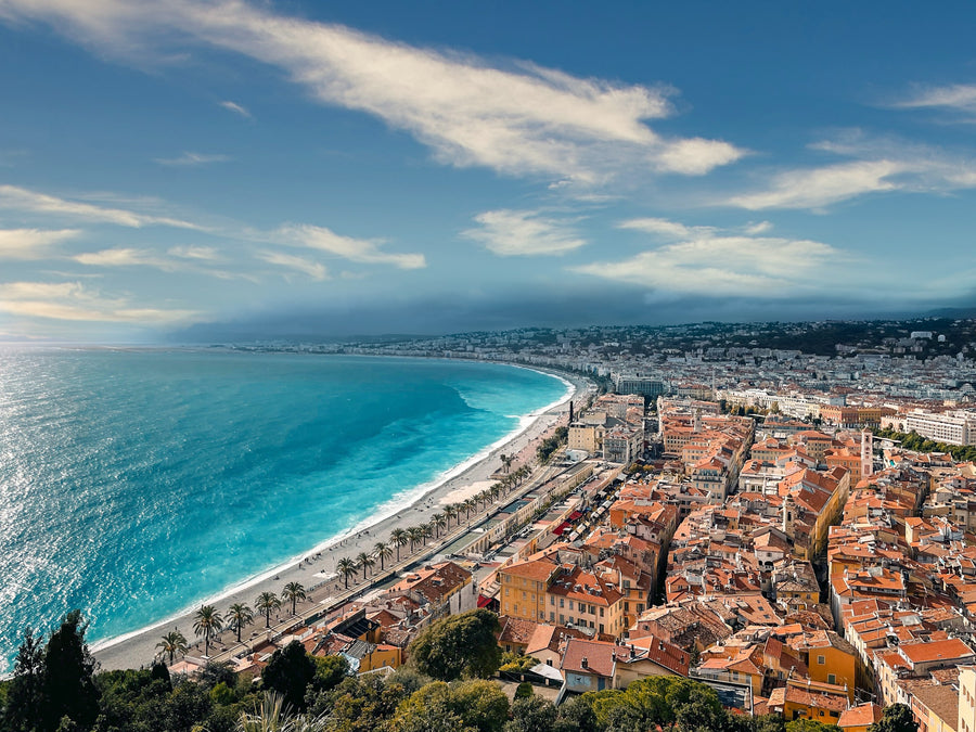 The curved bay and rooftops of Nice seen from the hill above the old town