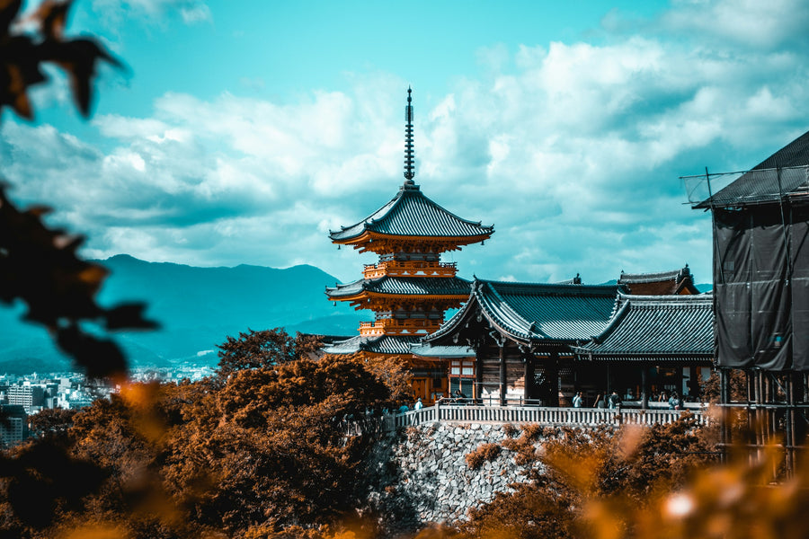 The red pagoda of Kiyomizu-dera temple on a hillside in Kyoto
