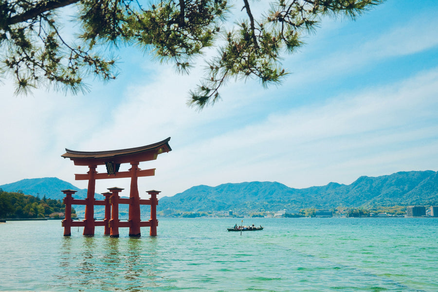 The red torii gate of Itsukushima Shrine standing in the sea off Miyajima