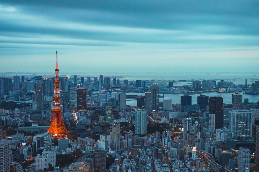 Tokyo Tower rising above the city skyline at dusk