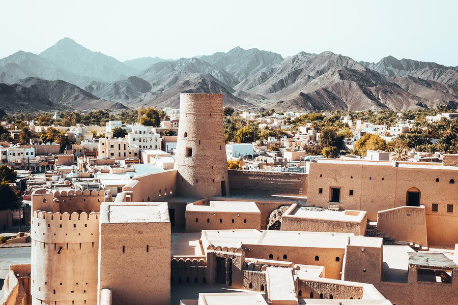 Old mud-brick houses and towers of Al Hamra below the Hajar Mountains, Oman